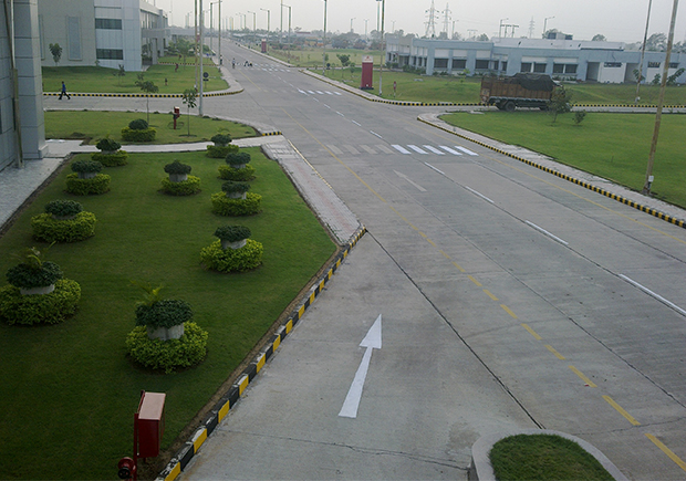 Gardener Mowing Backyard Garden Grass Aerial View.